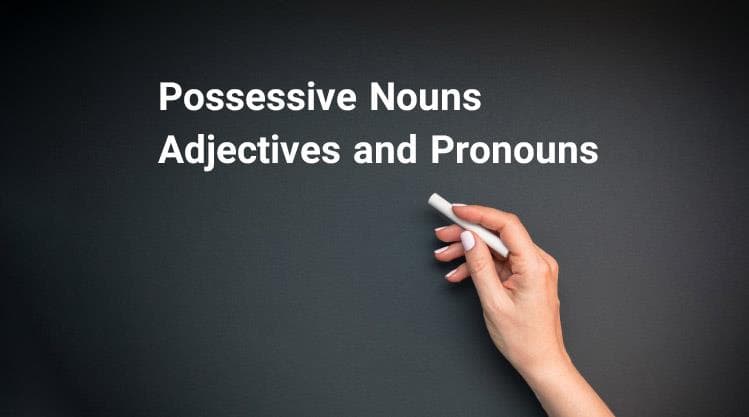 دستی که روی تخته در حال نوشتن possessive nouns, adjectives and pronouns است